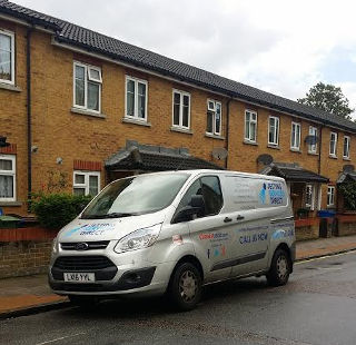 Clearing a blocked drain at terraced house in Anstey Road, Peckham Rye, South London SE15