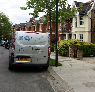 Investigate a blocked drain gully at the side of the property in Palewell Park, East Sheen, West London SW14